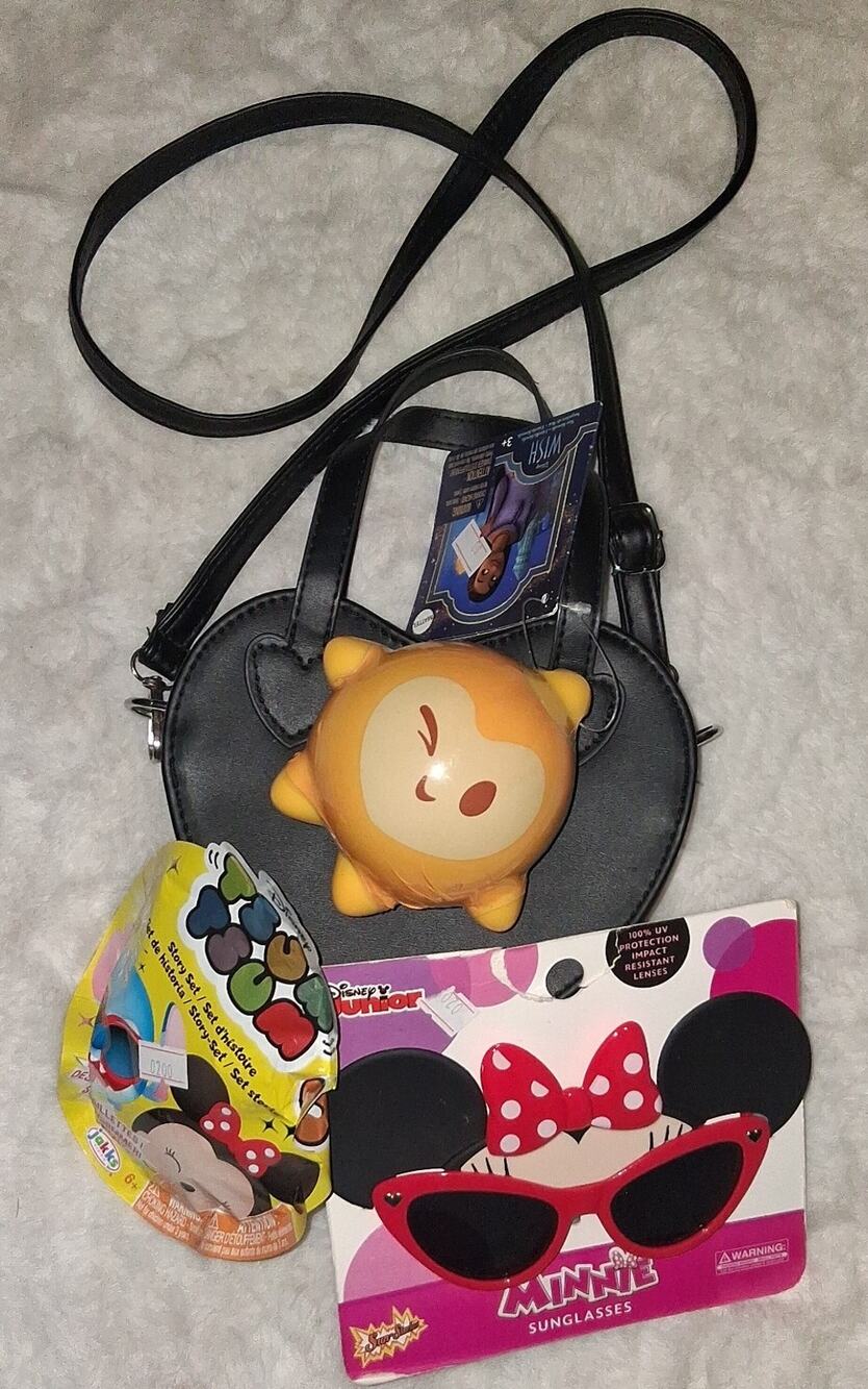 Heart shaped crossbody bag with Minnie Mouse sunglasses and squishy toy